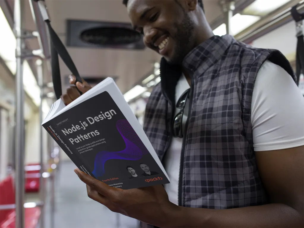 Man reading 'Node.js Design Patterns &ndash; Fourth Edition' on a subway train, standing and smiling; front cover with the purple wave design visible.